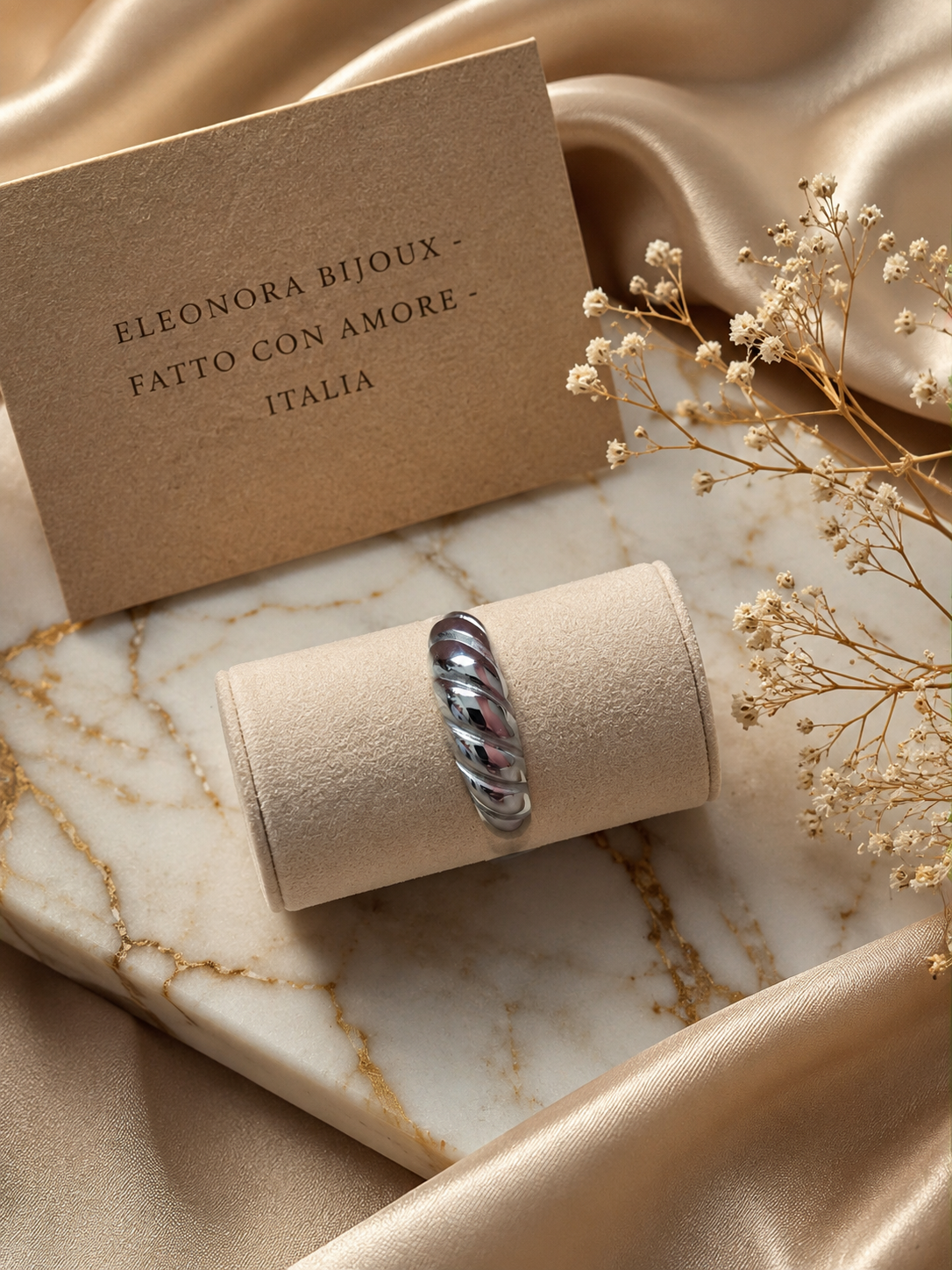 Bague argentée torsadée en acier inoxydable