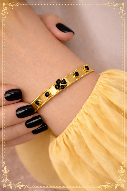 Jonc Doré en Acier Inoxydable et Pierres Noires